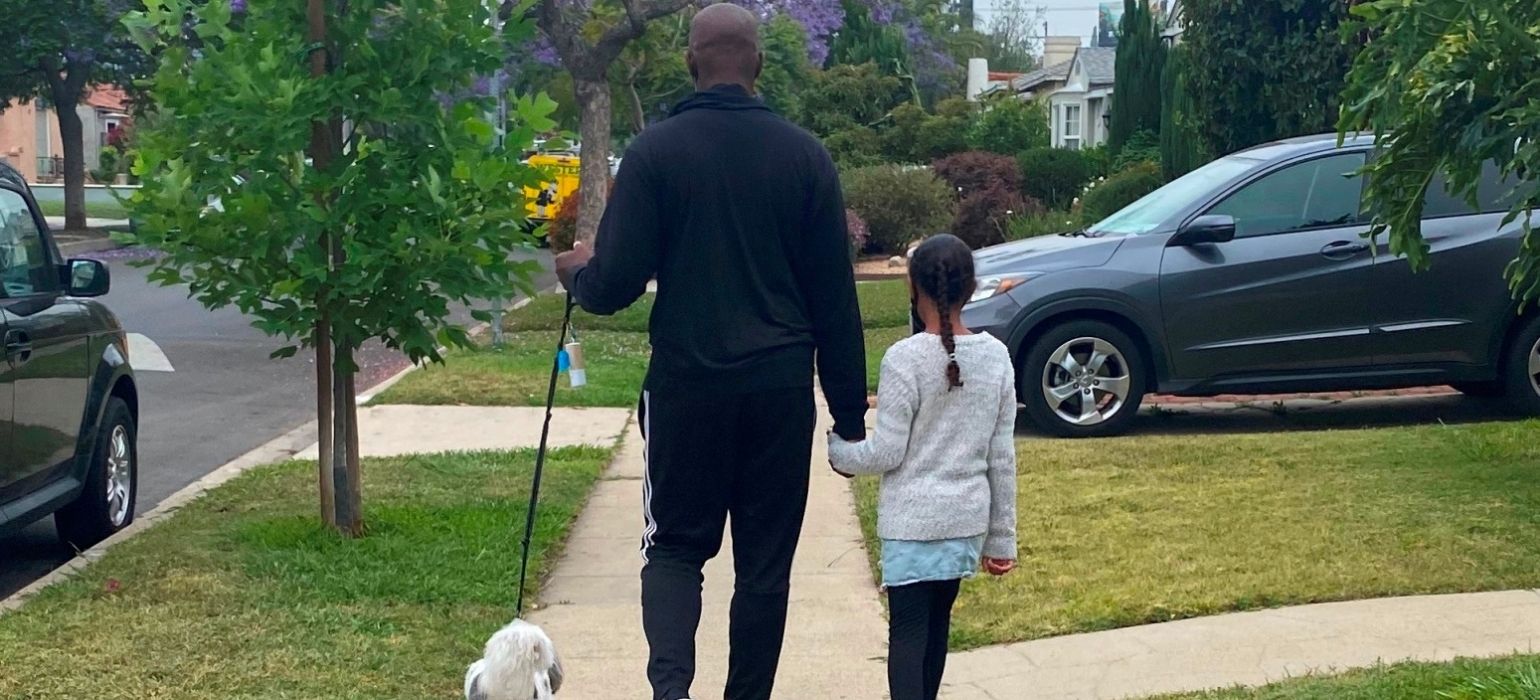 Shola Richards Walking His Dog With His Daughter