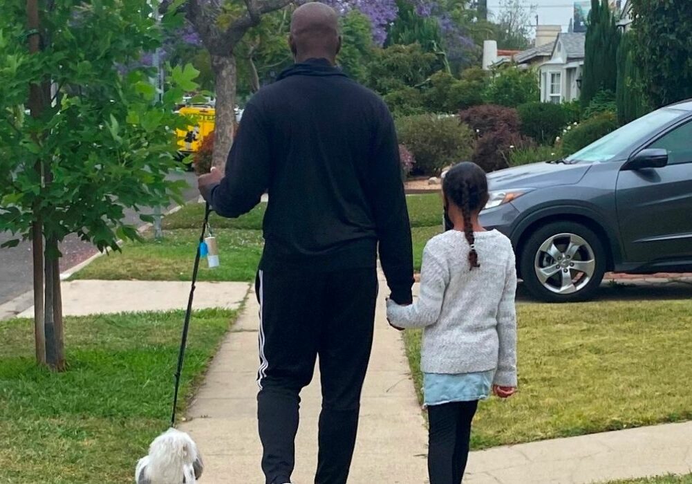 Shola Richards Walking His Dog With His Daughter