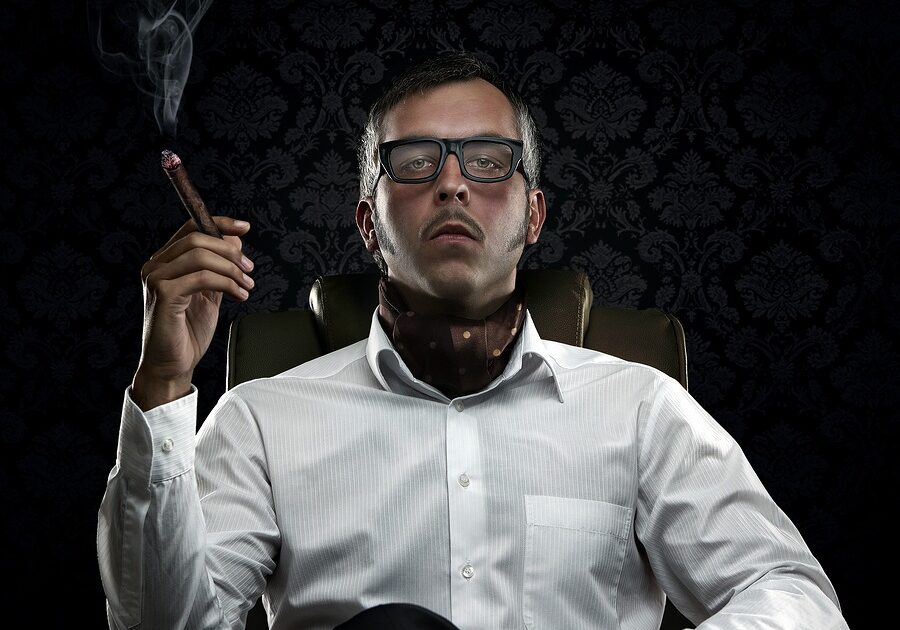 Stop taking yourself so seriously - Funny Portrait Of Rich Man With Serious Face Expression Smoking A Cigar
